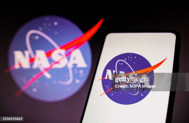 In this photo illustration, the NASA logo is displayed on a smartphone screen.