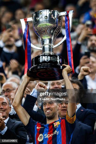 Sergio Busquets raises the trophy celebrates the championship of La Liga 2022/2023 season after the match against Real Sociedad at Spotify Camp Nou...