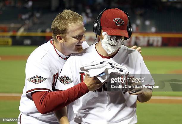 Starting pitcher Ian Kennedy of the Arizona Diamondbacks receives a shaving cream salute from J.J. Putz after defeating the Pittsburgh Pirates in the...