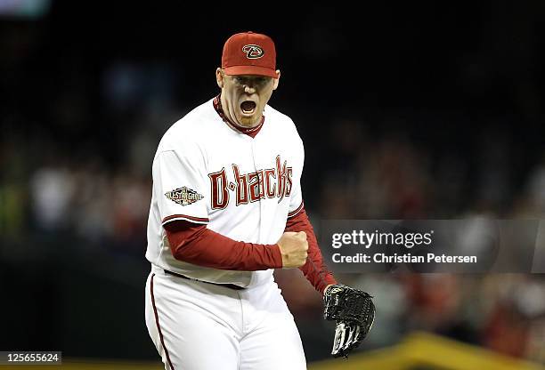 Relief pitcher J.J. Putz of the Arizona Diamondbacks celebrates after defeating the Pittsburgh Pirates in the Major League Baseball game at Chase...