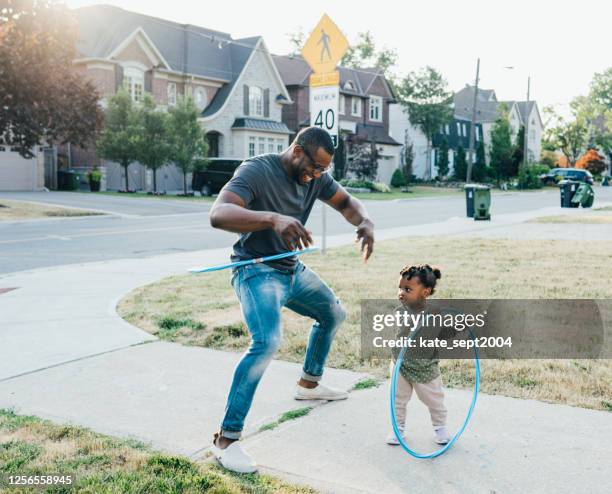 hula hoop with dad - springtime home stock pictures, royalty-free photos & images