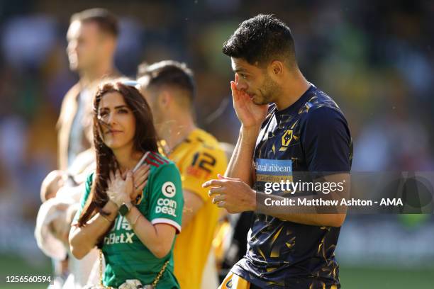 An emotional Raul Jimenez and his girlfriend, Daniela Basso walk around the pitch on the last home game of the season during the Premier League match...