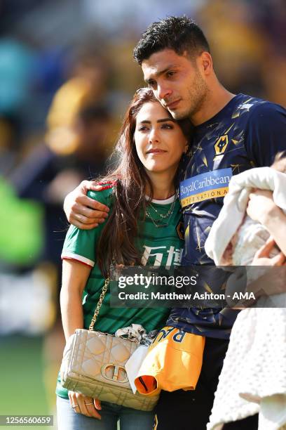 An emotional Raul Jimenez and his girlfriend, Daniela Basso walk around the pitch on the last home game of the season during the Premier League match...