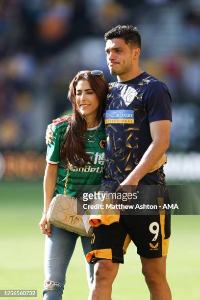 An emotional Raul Jimenez and his girlfriend, Daniela Basso walk around the pitch on the last home game of the season during the Premier League match...