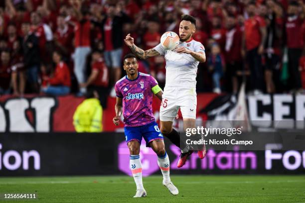 Lucas Ocampos of Sevilla FC competes for the ball with Danilo Luiz da Silva of Juventus FC during the UEFA Europa League semifinal second leg...