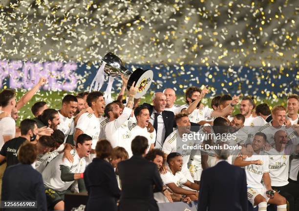 Sergio Ramos the Madrid captain lifts the La Liga trophy during the Liga match between Real Madrid CF and Villarreal CF at Estadio Alfredo Di Stefano...
