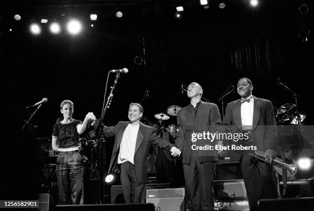 Ebet Roberts/Redferns) Annie Lennox , Paul Simon, Pete Townshend and Wynton Marsalis at the finale of Paul Simon's benefit concert for the Children's...