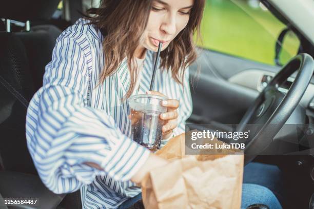 ready to dive in! - drinking soda in car stock pictures, royalty-free photos & images