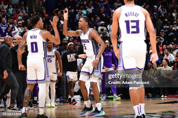 Malik Monk high fives De'Aaron Fox of the Sacramento Kings during the game against the LA Clippers on February 24, 2023 at Crypto.Com Arena in Los...