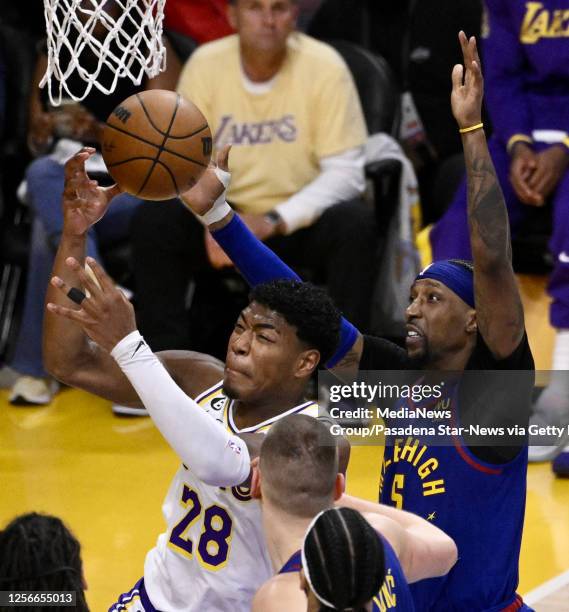 Los Angeles, Rui Hachimura of the Los Angeles Lakers drives to the basket against Kentavious Caldwell-Pope of the Denver Nuggets in the first half of...