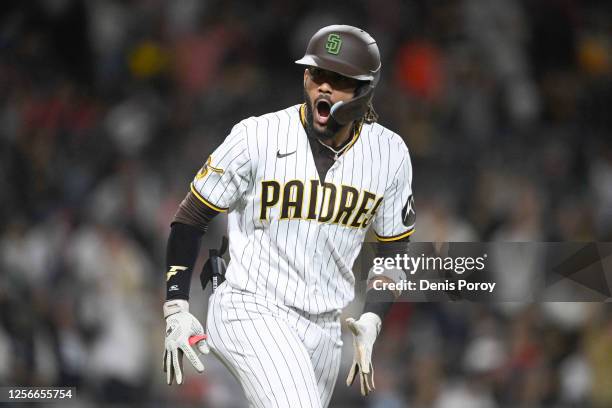 Fernando Tatis Jr. #23 of the San Diego Padres reacts after hitting a solo home run during the sixth inning of a baseball game against the Boston Red...