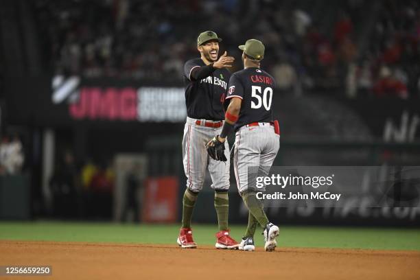 Carlos Correa and Willi Castro of the Minnesota Twins celebrate a 6-2 win over the Los Angeles Angels at Angel Stadium of Anaheim on May 20, 2023 in...