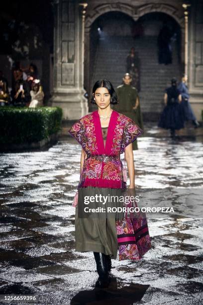 Models present creations from Christian Dior's Cruise 2024 collection during a fashion show at Colegio de San Ildefonso in Mexico City on May 20,...