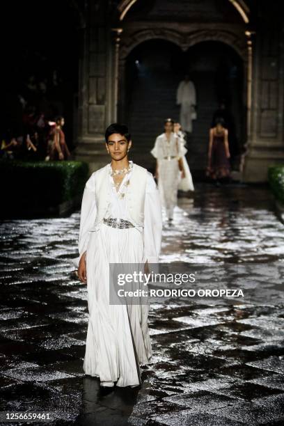 Models present creations from Christian Dior's Cruise 2024 collection during a fashion show at Colegio de San Ildefonso in Mexico City on May 20,...