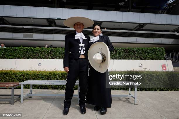 Charro and a skirmish pose at the Hipodromo de Las Americas located in Mexico City, on the occasion of the Charro and Skirmish Day, where some...