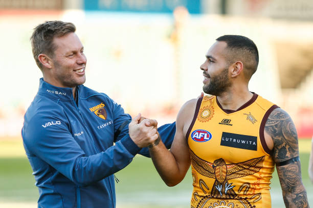 Sam Mitchell, Senior Coach of the Hawks and Jarman Impey of the Hawks celebrate during the 2023 AFL Round 10 match between the Hawthorn Hawks and the...