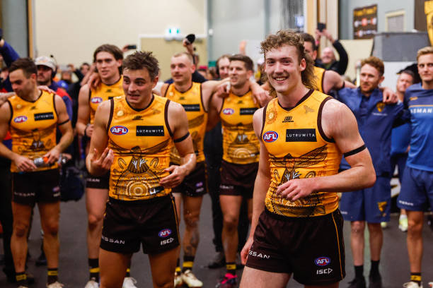 Josh Weddle of the Hawks sings the team song during the 2023 AFL Round 10 match between the Hawthorn Hawks and the West Coast Eagles at UTAS Stadium...