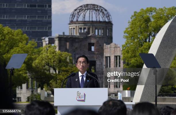 Japanese Prime Minister Fumio Kishida speaks in front of the Cenotaph for Atomic Bomb Victims and the Atomic Bomb Dome in the Peace Memorial Park...