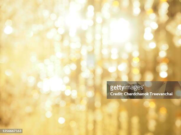 blurred bokeh light - gold coloured stock pictures, royalty-free photos & images