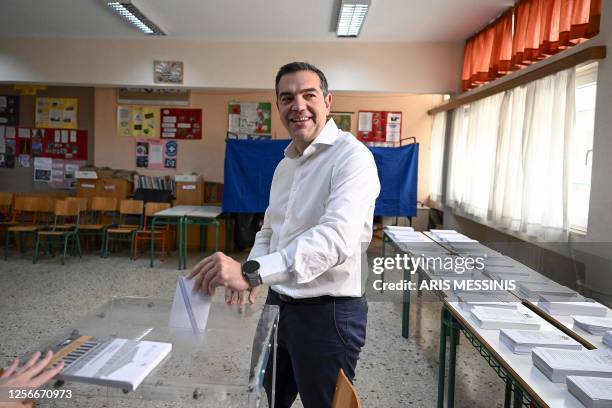 Leader of the leftist Syriza party Alexis Tsipras casts his ballot at a polling station on the general elections day in Athens on May 21, 2023....