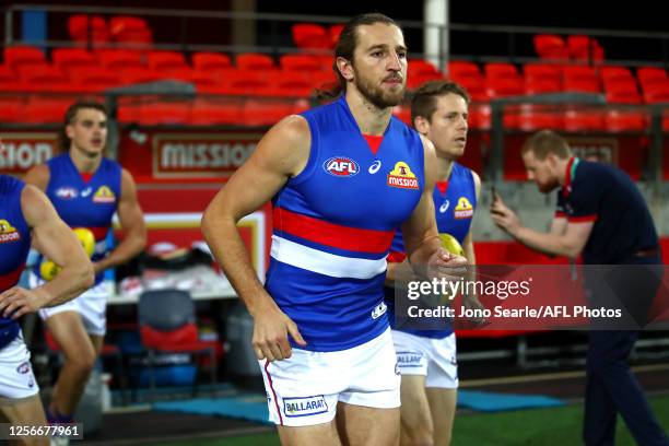 Marcus Bontempelli of the Bulldogs leads his team out during the round 7 AFL match between the Essendon Bombers and the Western Bulldogs at Metricon...