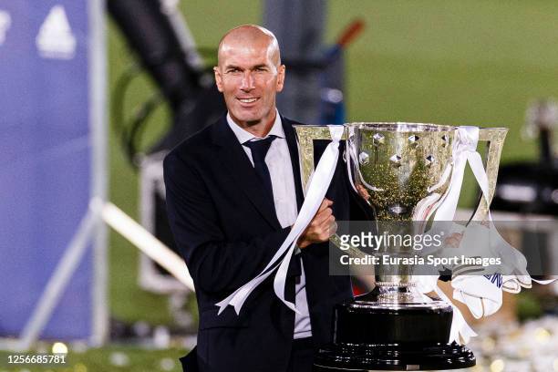 Zinedine Zidane head coach of Real Madrid celebrates with the La Liga trophy after the La Liga match between Real Madrid CF and Villarreal CF at...