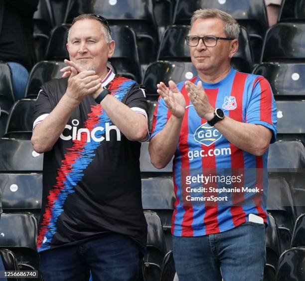 Crystal Palace fans applaud their team during the pre-match warm-up during the Premier League match between Fulham FC and Crystal Palace at Craven...