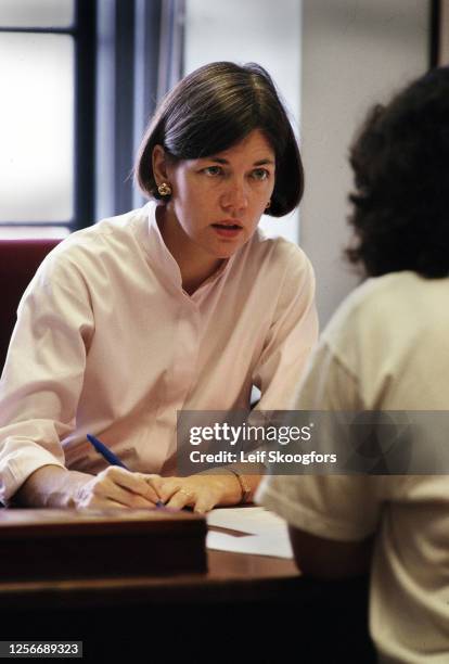 In her office, American academic Professor Elizabeth Warren meets with an unidentified student at University of Pennsylvania Law School,...