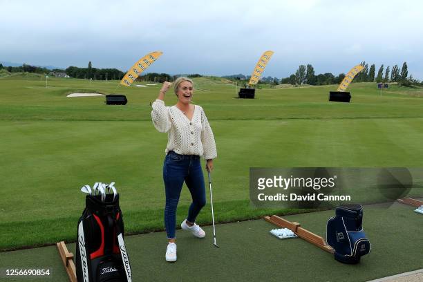 Amy Boulden of Wales celebrates a successful shot during the pitching challenge at the pre-tournament BBQ held at the clubhouse during The Rose...