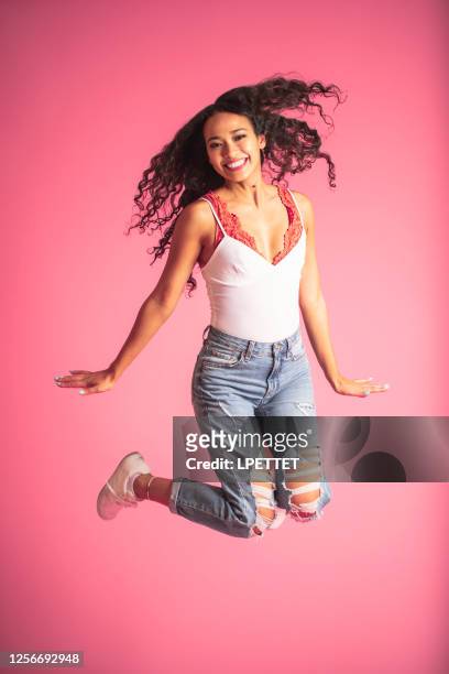 jumping for joy - filipino ethnicity stock pictures, royalty-free photos & images