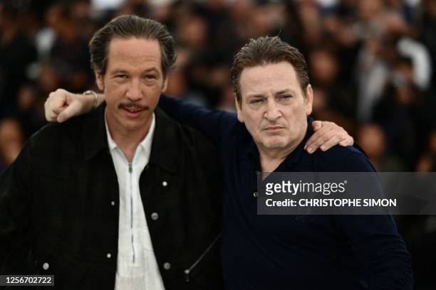 French actor Reda Kateb and French actor Benoit Magimel pose during a photocall for the film "Omar la Fraise" at the 76th edition of the Cannes Film...