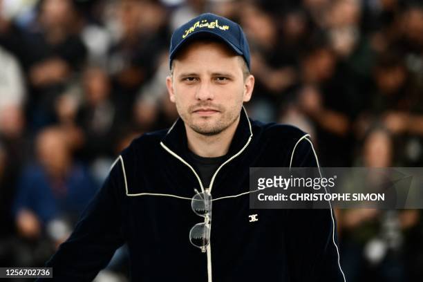 French-Algerian director Elias Belkeddar poses during a photocall for the film "Omar la Fraise" at the 76th edition of the Cannes Film Festival in...