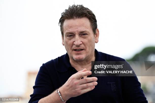 French actor Benoit Magimel poses during a photocall for the film "Omar la Fraise" at the 76th edition of the Cannes Film Festival in Cannes,...