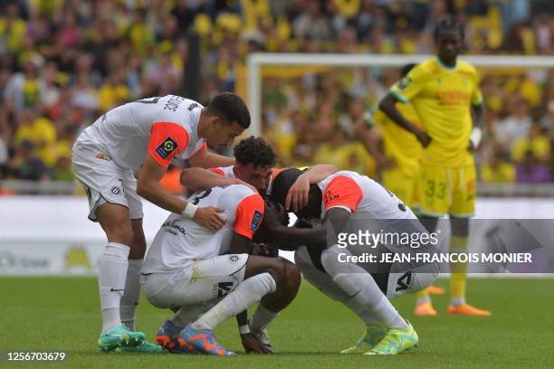 Montpellier's Guinean defender Issiaga Sylla reacts with teammates after winning the French L1 football match between FC Nantes and Montpellier...
