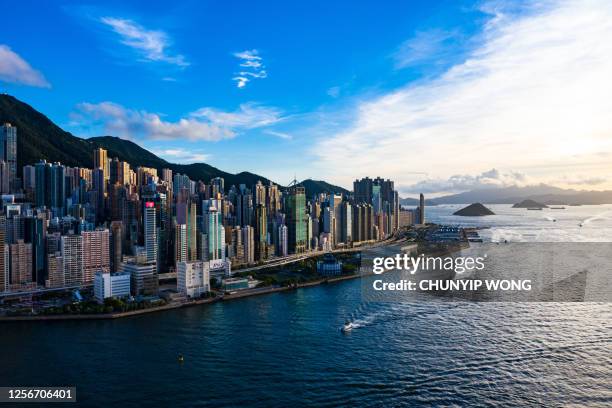 drone view of victoria harbour, hong kong - sheung wan stock pictures, royalty-free photos & images