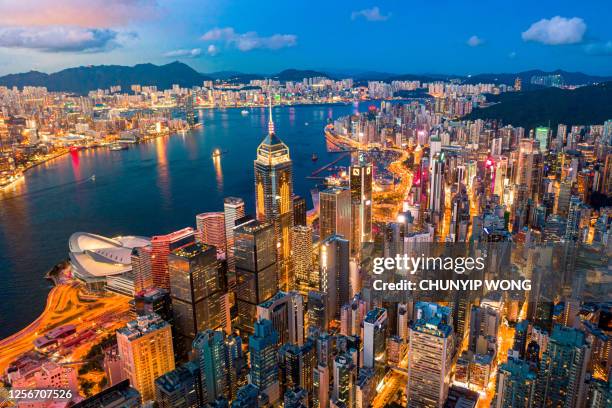 hong kong city skyline at night - hong kong skyline drone stock pictures, royalty-free photos & images