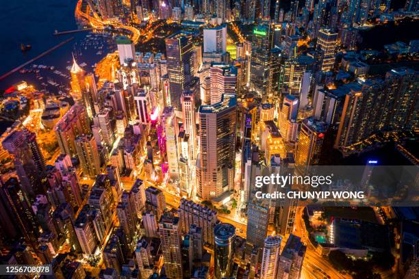 hong kong city skyline at night - hong kong skyline drone stock pictures, royalty-free photos & images