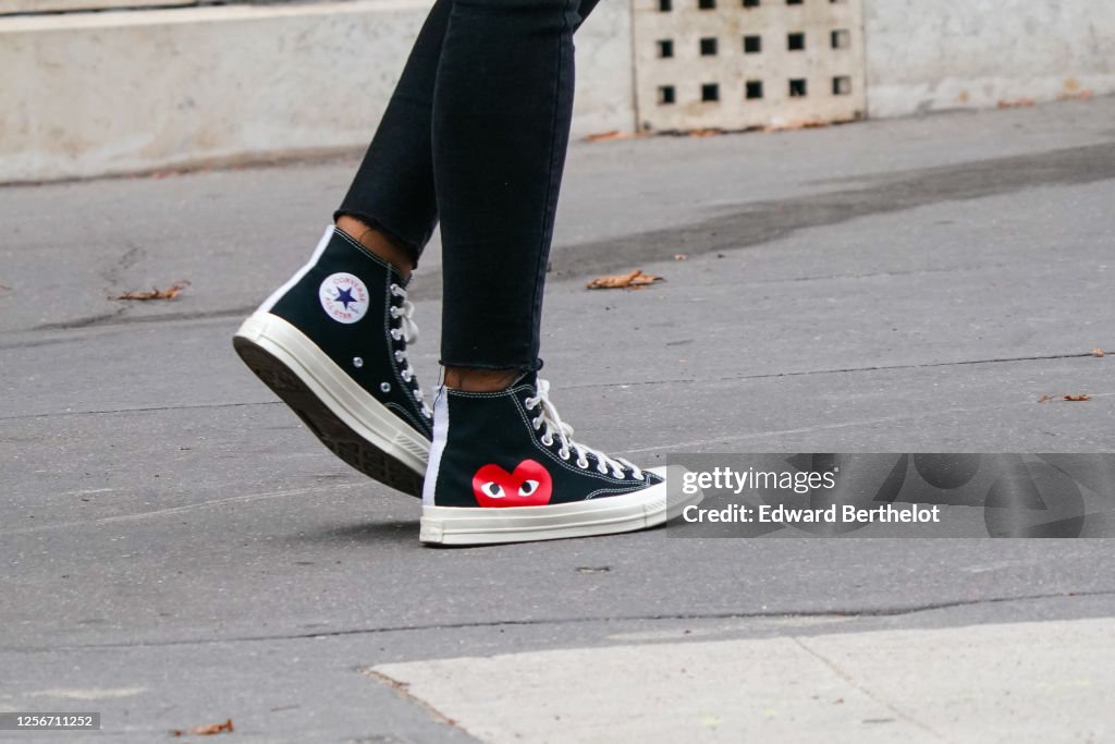 A passerby wears Converse x CDG Comme des garcons sneakers shoes, on... News Photo - Getty Images A passerby wears Converse x CDG Comme des garcons sneakers shoes, on... News Photo - Getty Images