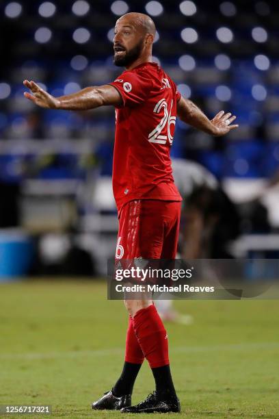 Laurent Ciman of Toronto FC reacts against the Montreal Impact during a Group C match as part of the MLS Is Back Tournament at ESPN Wide World of...