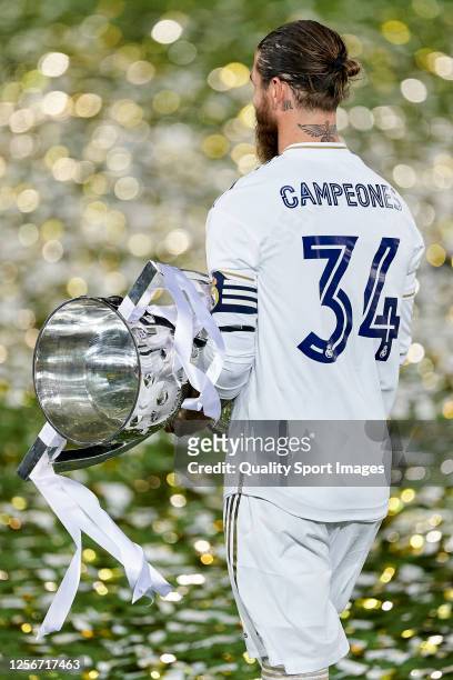 Sergio Ramos of Real Madrid CF walking with the La Liga trophy after Real Madrid secure the La Liga title during the La Liga match between Real...
