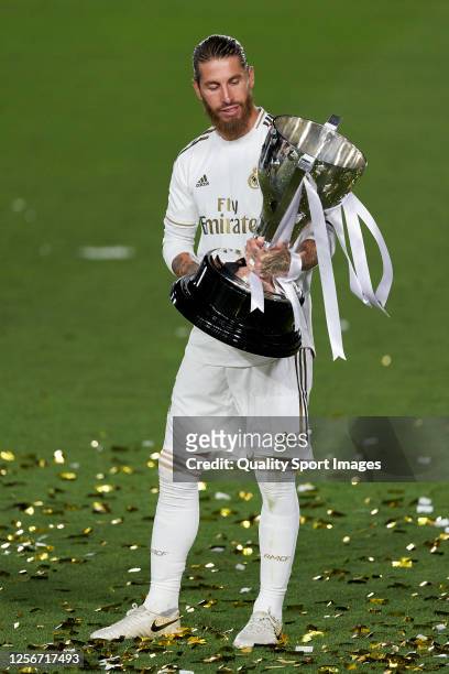 Sergio Ramos of Real Madrid CF posing with the La Liga trophy after Real Madrid secure the La Liga title during the La Liga match between Real Madrid...