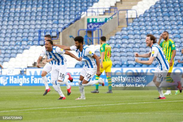 Chris Willock of Huddersfield Town celebrates his goal to make it 1-0 with his team mates during the Sky Bet Championship match between Huddersfield...