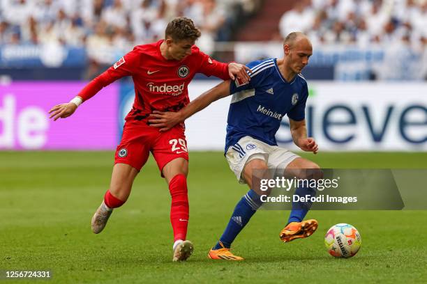 Jesper Lindstroem of Eintracht Frankfurt and Henning Matriciani of FC Schalke 04 battle for the ball during the Bundesliga match between FC Schalke...