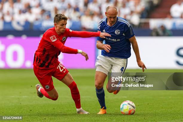 Jesper Lindstroem of Eintracht Frankfurt and Henning Matriciani of FC Schalke 04 battle for the ball during the Bundesliga match between FC Schalke...