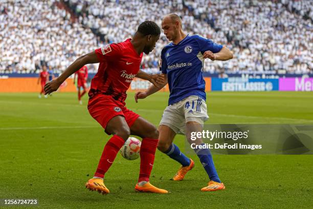 Almamy Toure of Eintracht Frankfurt and Henning Matriciani of FC Schalke 04 battle for the ball during the Bundesliga match between FC Schalke 04 and...