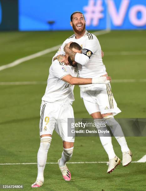 Sergio Ramos of Real Madrid congrtatulates Karim Benzema after Benzema scored the second goal from a penalty during the Liga match between Real...