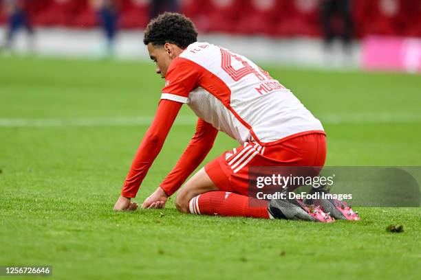 Jamal Musiala of Bayern Muenchen looks dejected during the Bundesliga match between FC Bayern München and RB Leipzig at Allianz Arena on May 20, 2023...