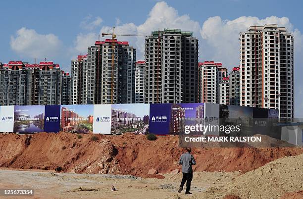 Empty apartment developments stand in the city of Ordos, Inner Mongolia on September 12, 2011. The city which is commonly referred to as a "Ghost...