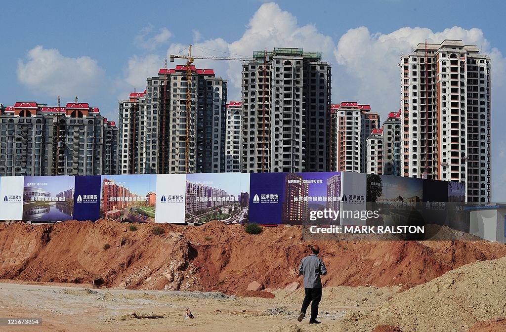 Empty apartment developments stand in th