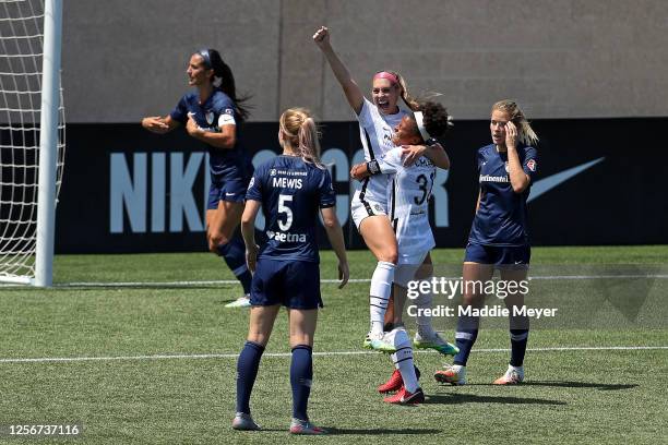 Morgan Weaver of Portland Thorns FC celebrates after scoring a goal in the 68th minute against Katelyn Rowland of North Carolina Courage during the...